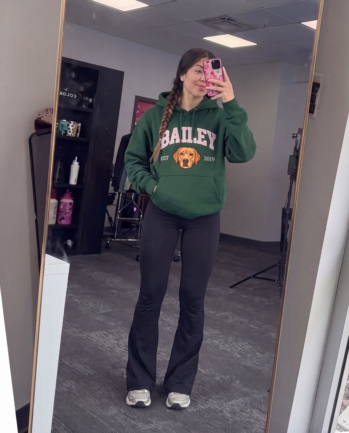 Customer wearing the green Bailey University hoodie
