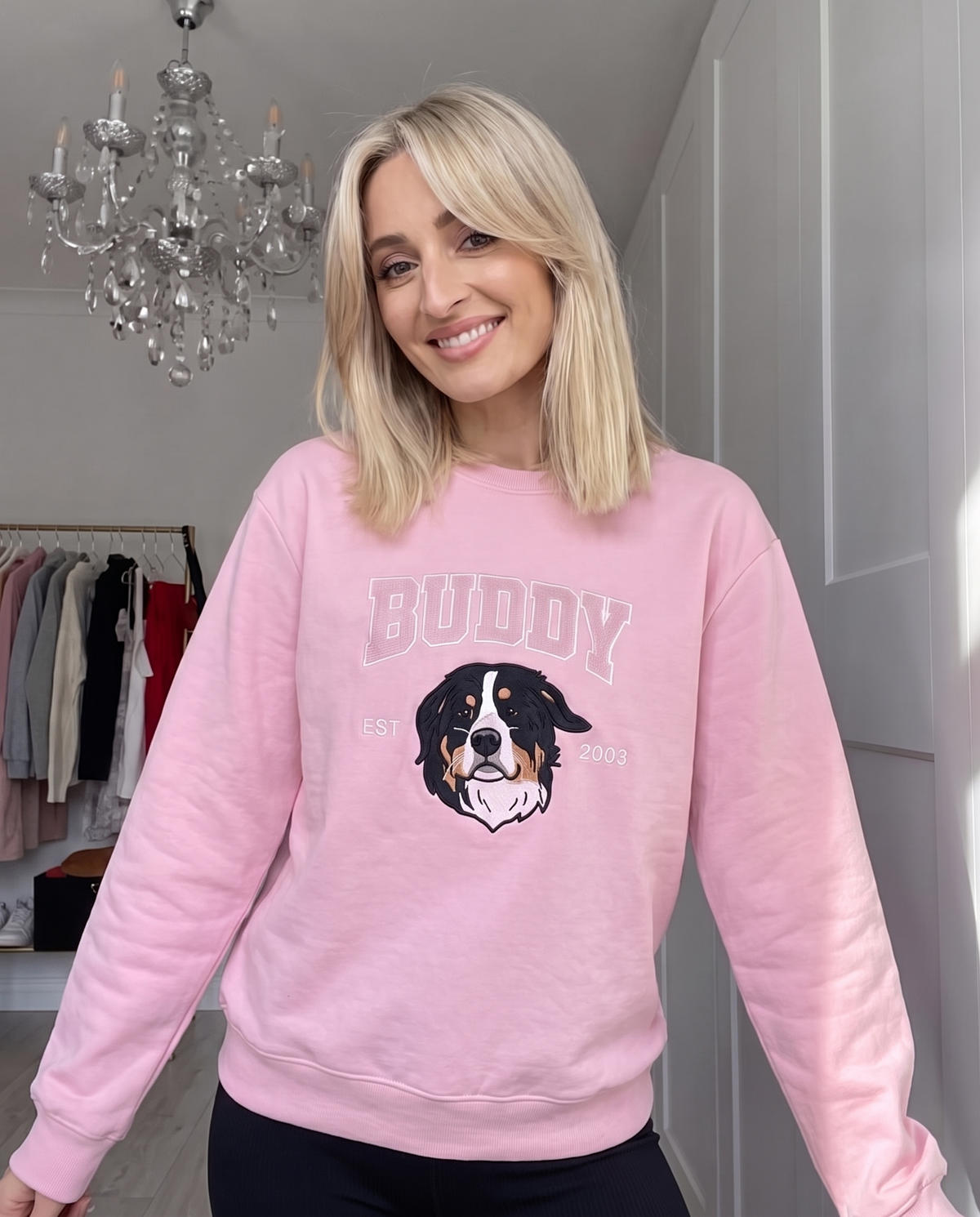 Customer wearing the pink Buddy University sweatshirt